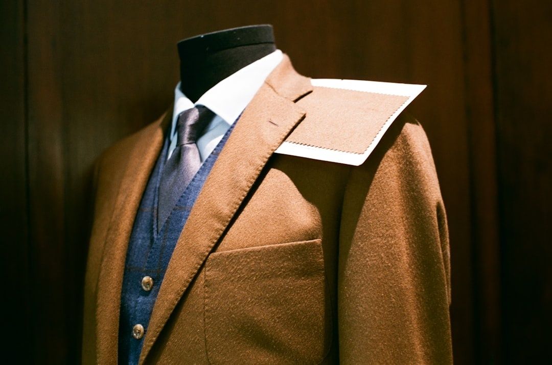 Tailored brown jacket and blue waistcoat displayed on a headless mannequin
